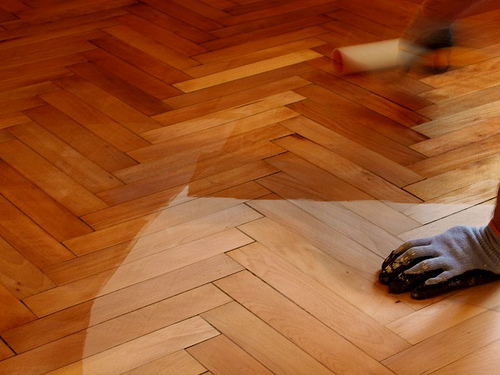 Roller Varnishing Floor by Rubber Dragon hardwood floor photo